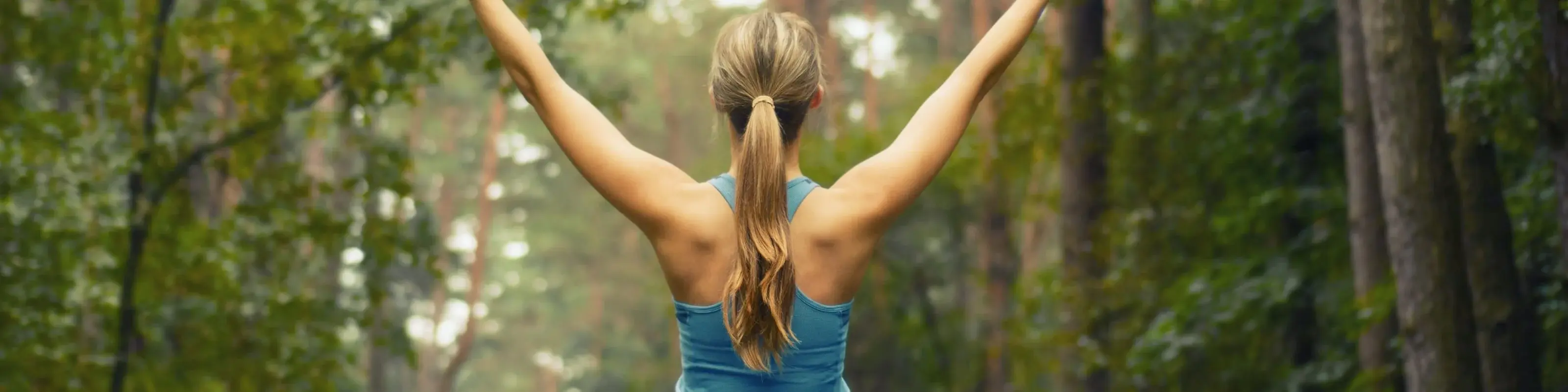 Person stretching in a forest