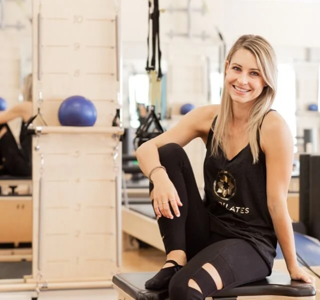 Person smiling at Club Pilates